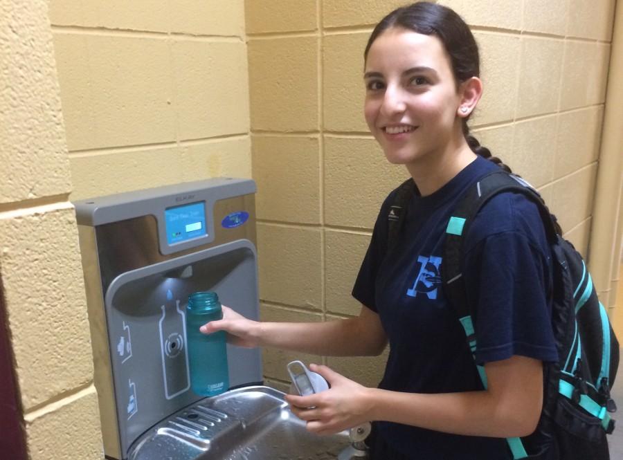 Senior Alyssa Vondrasek takes advantage of the new water stations. Unseasonably hot temperatures in the first week of September made staying hydrated essential. 
