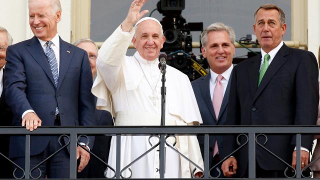 WASHINGTON, DC - SEPTEMBER 24:  Pope Francis waves to crowd from the balcony of the US Capitol building, after his address to a joint meeting of the U.S. Congress, September 24, 2015 in Washington, D.C.  Joining him are, ( L to R)Arch Bishop Joseph E. Kurtz, Vice President Joe Biden, Senate Majority Leader Kevin McCarthy of California, House Speaker John Boehner Nancy Pelosi, Minority Leader, Cardinal Donald Wuerl.
(Photo by Evy Mages/Getty Images)