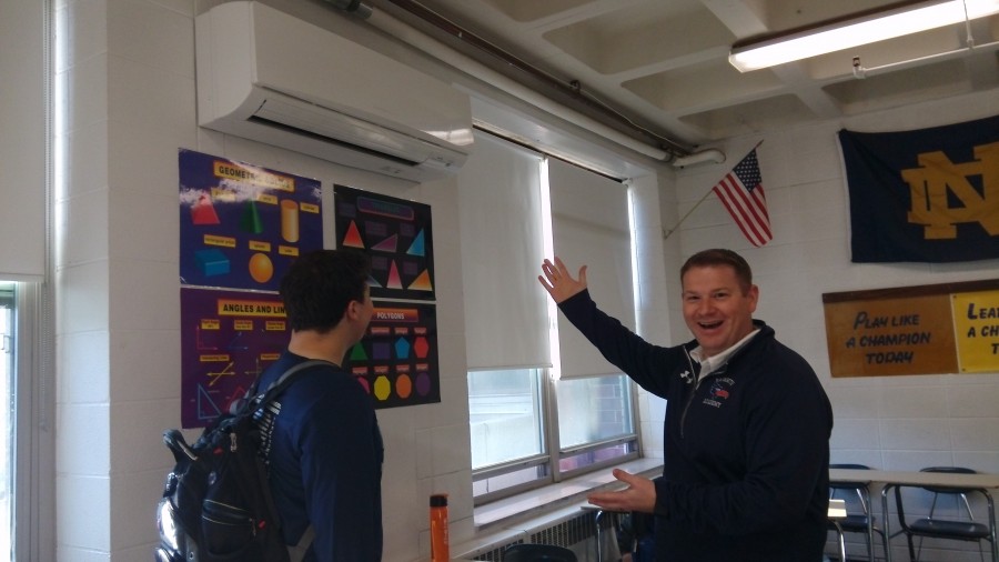 Mr. Drinan shows of his relatively new air conditioning unit. Mr. Drinan prefers cool temps to keep everyone focused.