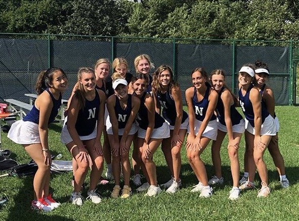 The Varsity Team poses for a picture after a home match