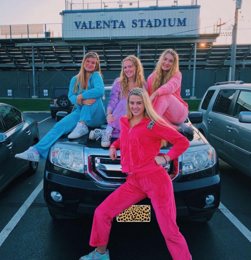 Seniors dress up as the Cheetah Girls for 2000s day during homecoming week.  Back row l to r: Sarah Blair, Ally Surowiec, Cate Ferguson Front: Ella Sandt


