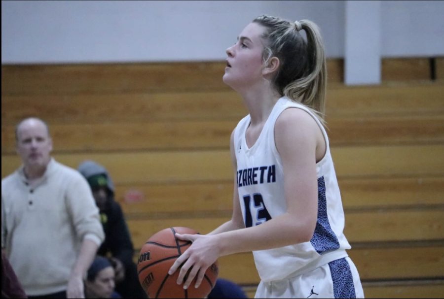 Freshman Mackenzie Hyland shooting free throw during game Vs Metea Valley. 
