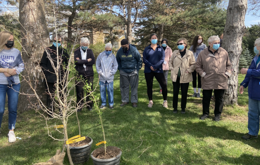 Sisters from The Congregation of St. Joseph, faculty, and students come together to bless the trees before planting them.