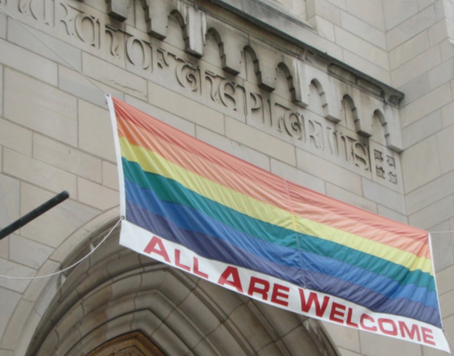 Portal of the Church of Pilgrims, in Washington, DC, with LGBTQ banner. Photo Wikimedia Commons.
