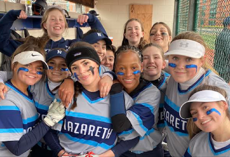 The softball team huddling in the dugout.