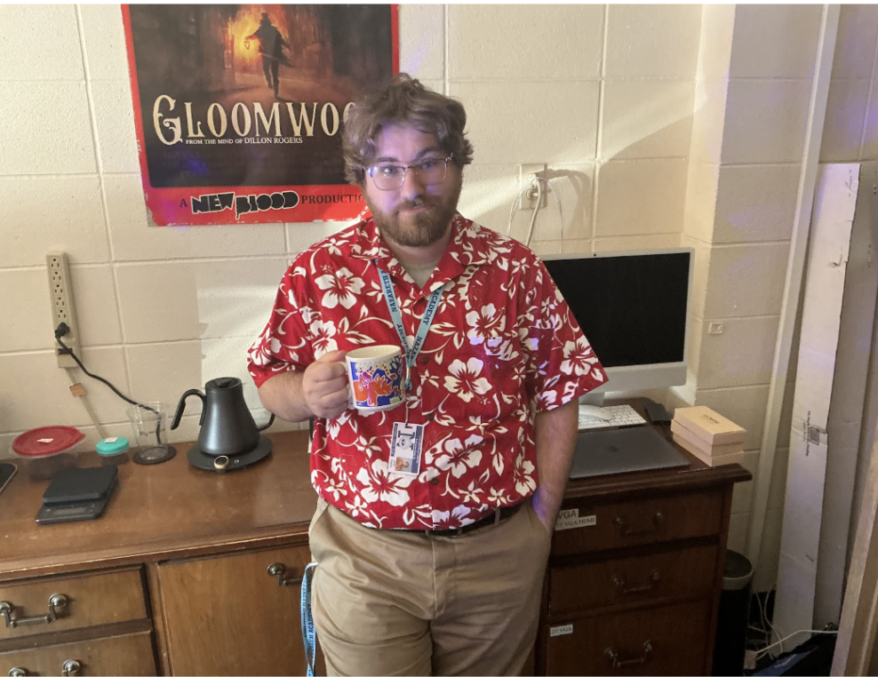 Wiggins enjoys a cup of coffee wearing one of his many Hawaiian shirts. 
