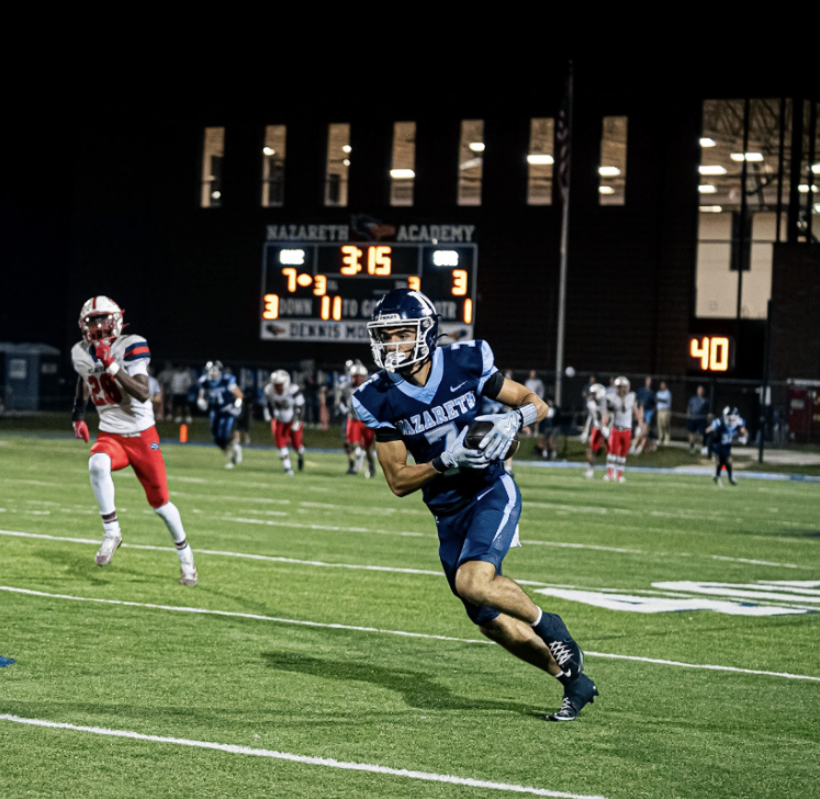 Senior Jake Cestone running the ball.
